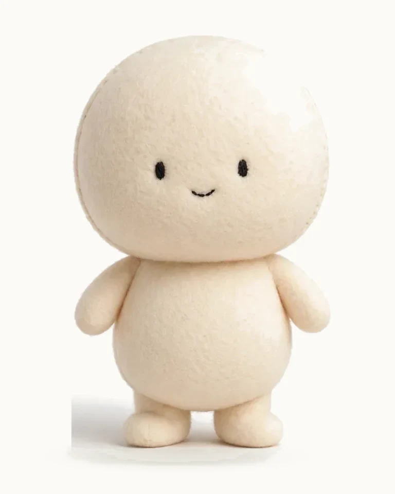 A plain cream felt doll — the very blank the crew dresses in the film — waiting to become someone